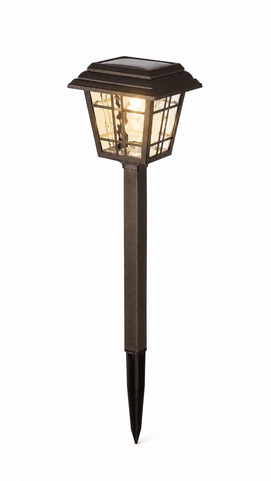Solar garden light with a warm LED lantern head on a spike mount